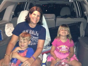 Seated in the back of the CRV.