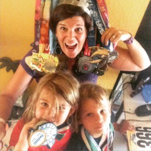 Selfie with a medal. The 2 blonde ones at the bottom are my favorite medals.